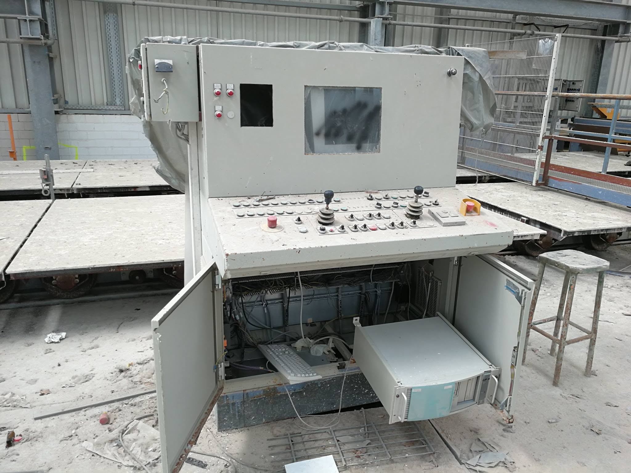 An old industrial control installation in an abandoned building.